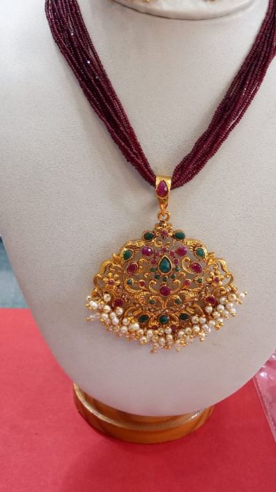 1.Maroon colored bead Necklace with 